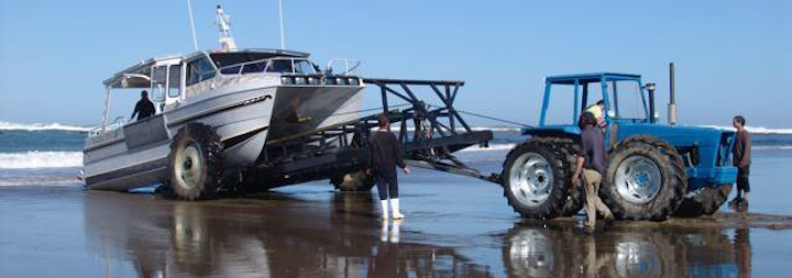 Tractor and lobster fishing boat on trailer